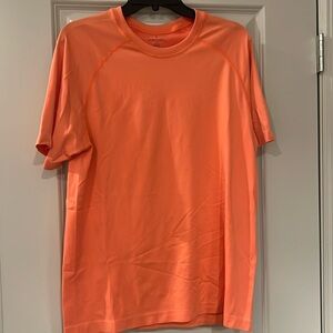 Never Worn Fabletics short sleeve workout shirt - peach/orange color Size Large